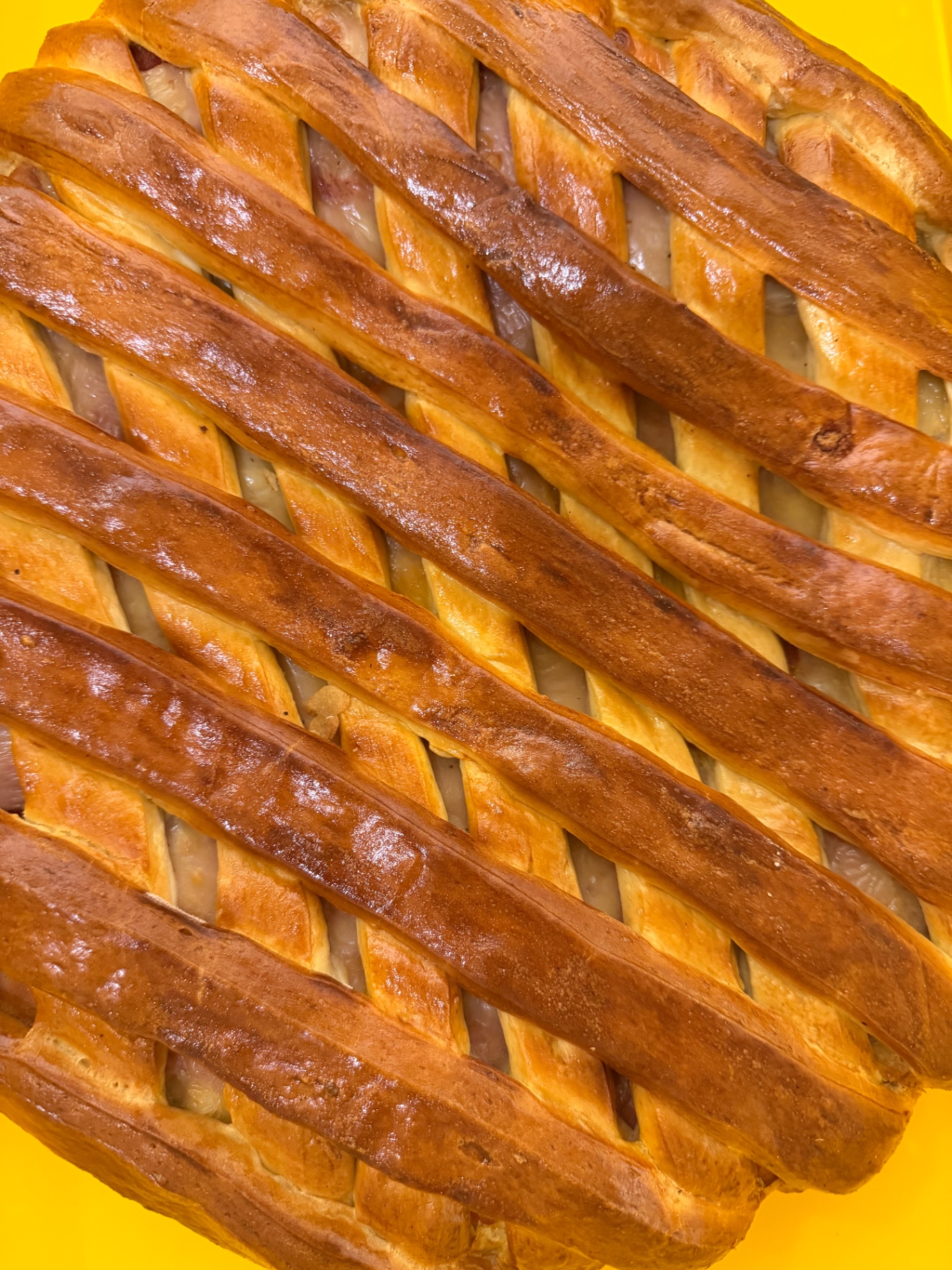 Freshly baked Portuguese folhado with golden lattice pastry